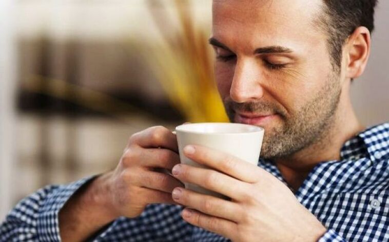 A man drinks a herbal tea drink to increase potency